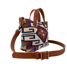 Load image into Gallery viewer, Side view of women&#39;s southwestern mini tote handbag. Chestnut brown leather handles with a removable, buckle adjustable strap.  Antique brass hardware.
